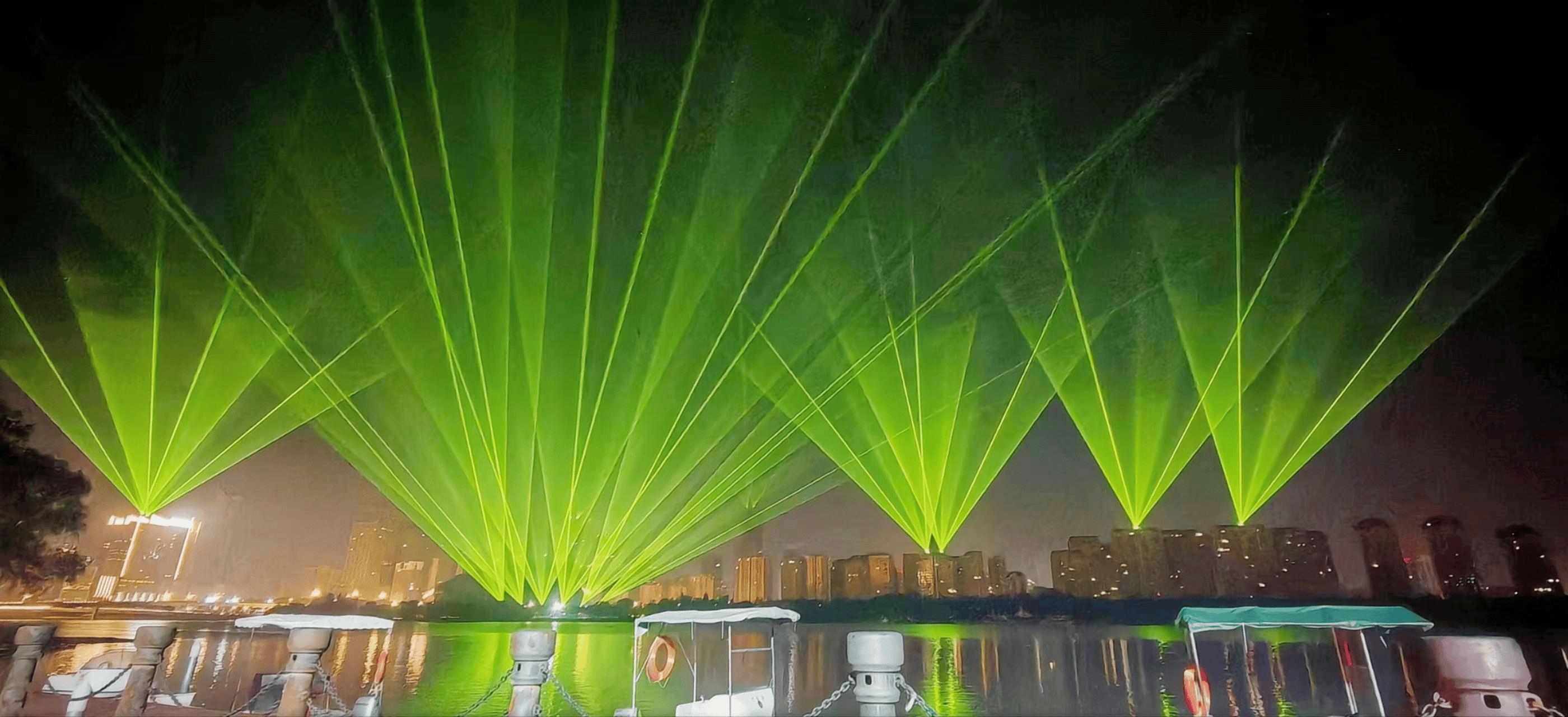 Blue laser beams illuminating the Shenyang Hunhe River waterfront and city skyline at night URL	shenyang-hunhe-river-laser-show