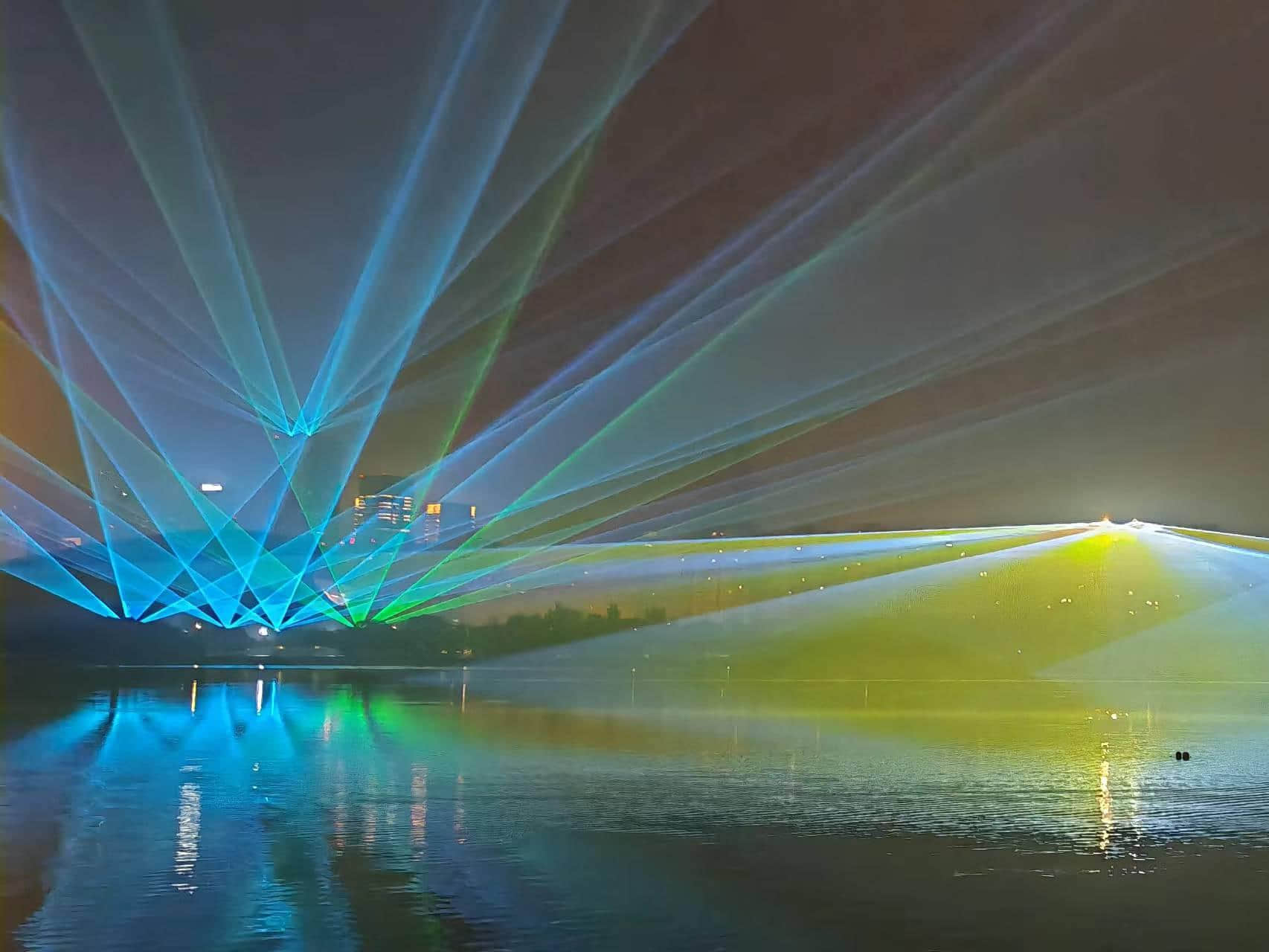 Blue laser beams illuminating the Shenyang Hunhe River waterfront and city skyline at night URL	shenyang-hunhe-river-laser-show