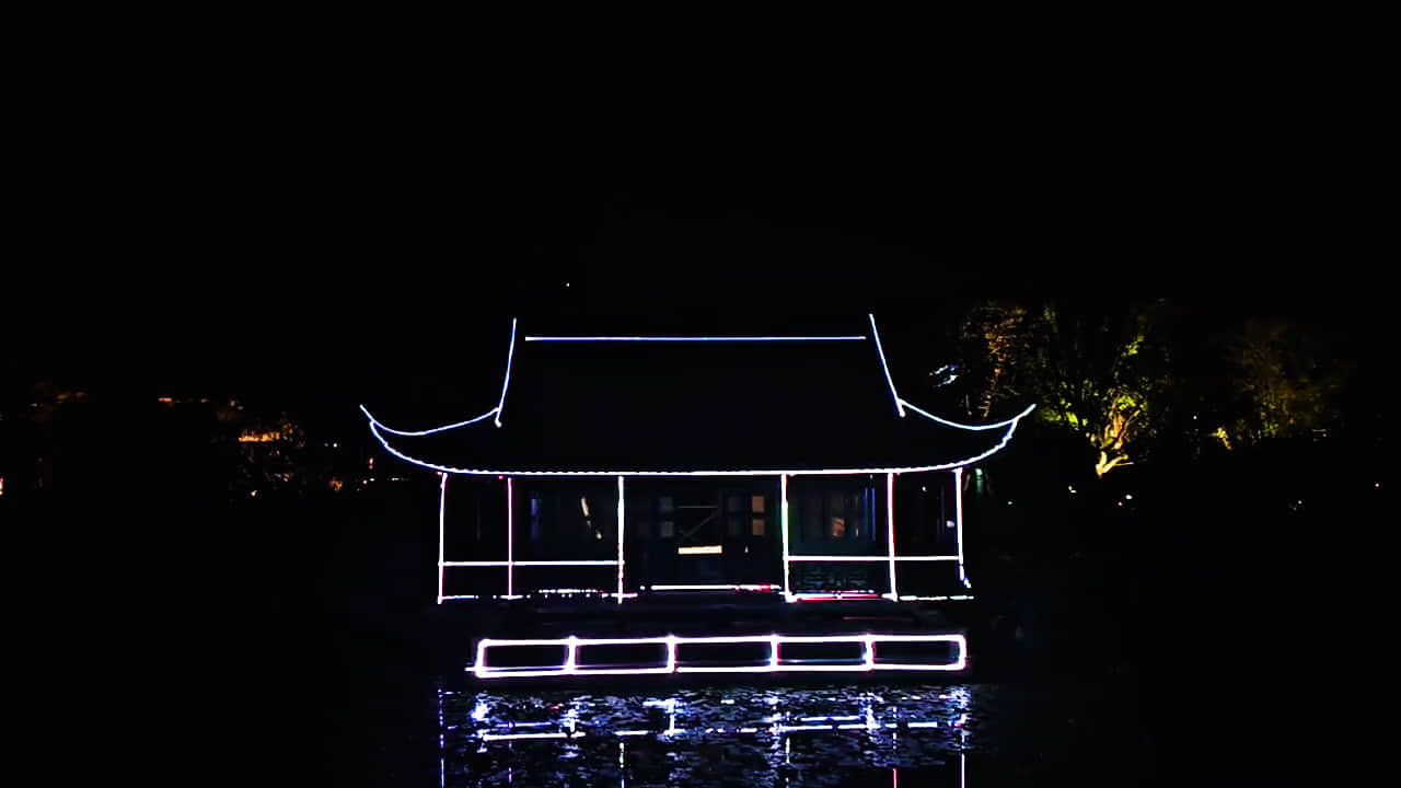 Nanbei Lake scenic area laser lighting project featuring illuminated architecture and blue landscape light effects in Jiaxing China Nanbei Lake scenic area laser lighting project featuring illuminated architecture and blue landscape light effects in Jiaxing China