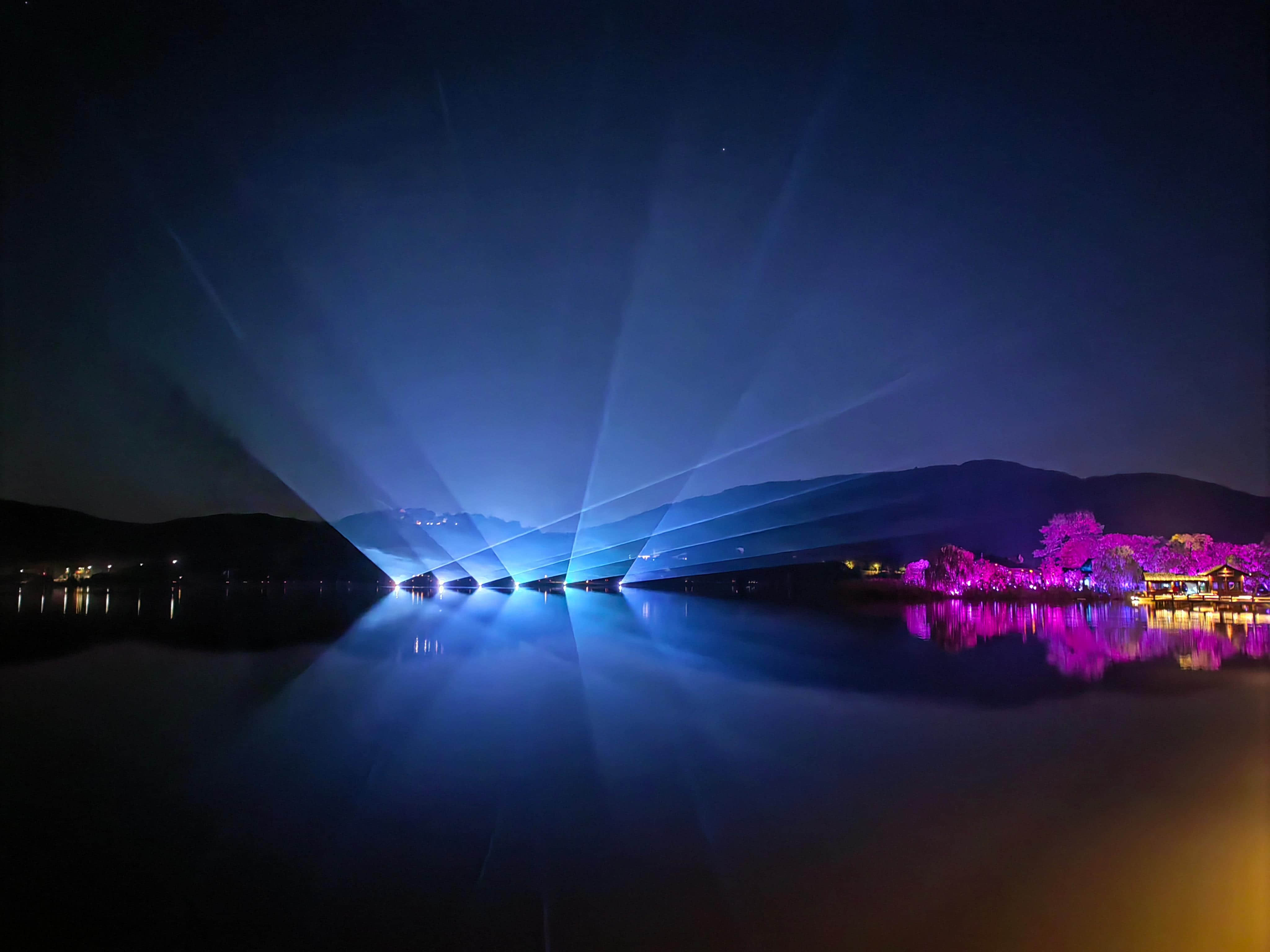 Nanbei Lake scenic area laser lighting project featuring illuminated architecture and blue landscape light effects in Jiaxing China Nanbei Lake scenic area laser lighting project featuring illuminated architecture and blue landscape light effects in Jiaxing China
