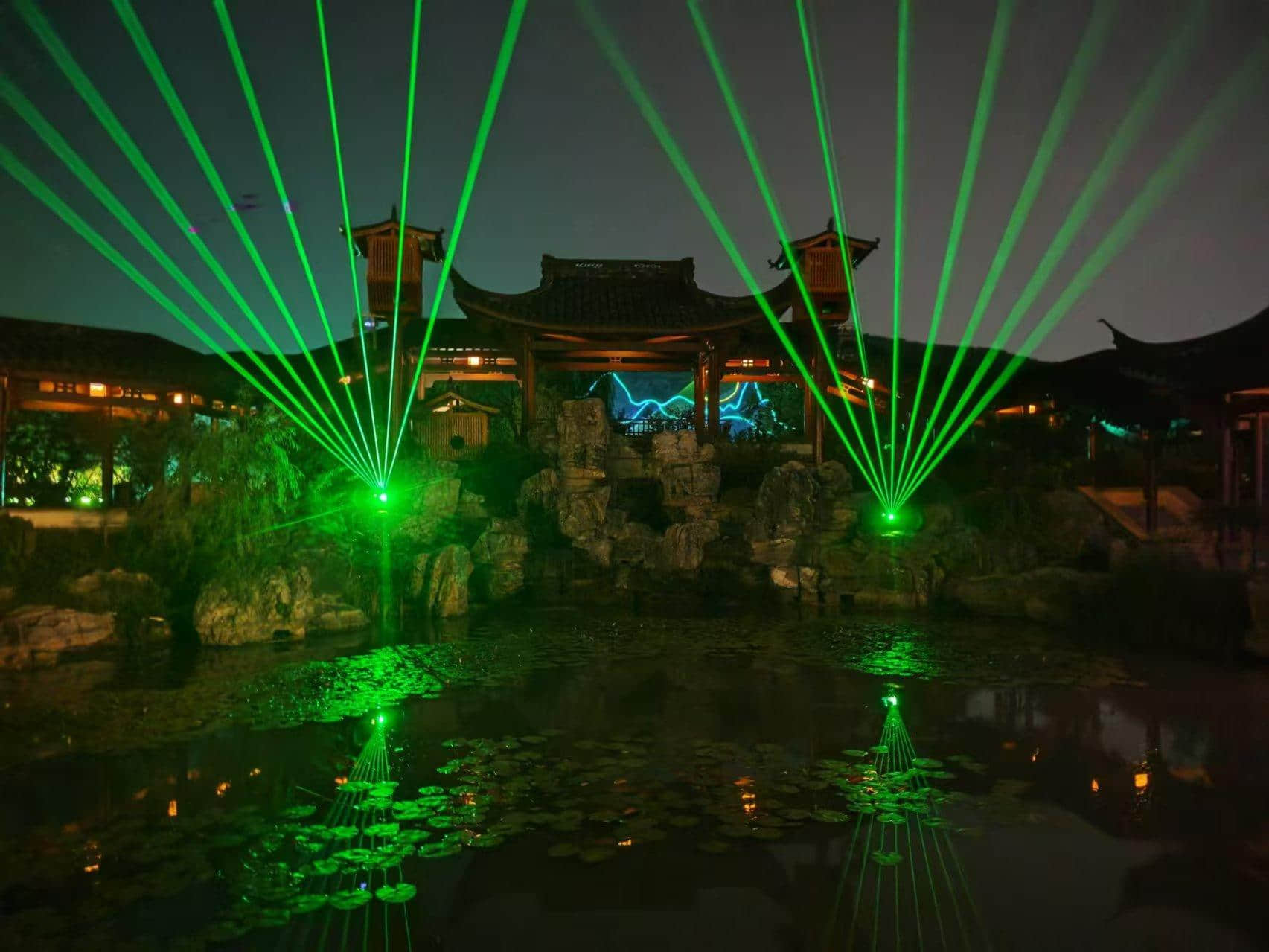 Nanbei Lake scenic area laser lighting project featuring illuminated architecture and blue landscape light effects in Jiaxing China Nanbei Lake scenic area laser lighting project featuring illuminated architecture and blue landscape light effects in Jiaxing China