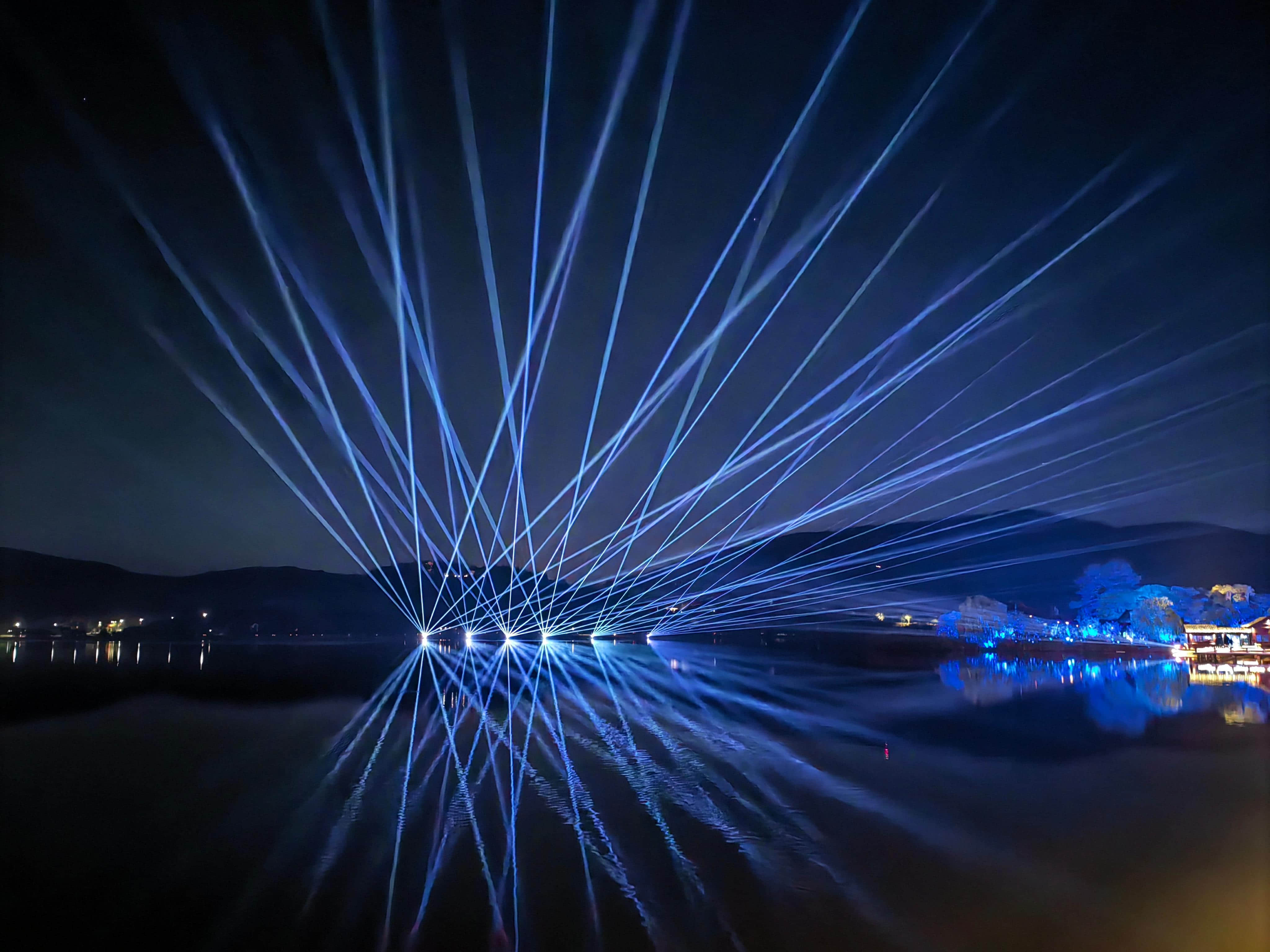 Nanbei Lake scenic area laser lighting project featuring illuminated architecture and blue landscape light effects in Jiaxing China Nanbei Lake scenic area laser lighting project featuring illuminated architecture and blue landscape light effects in Jiaxing China