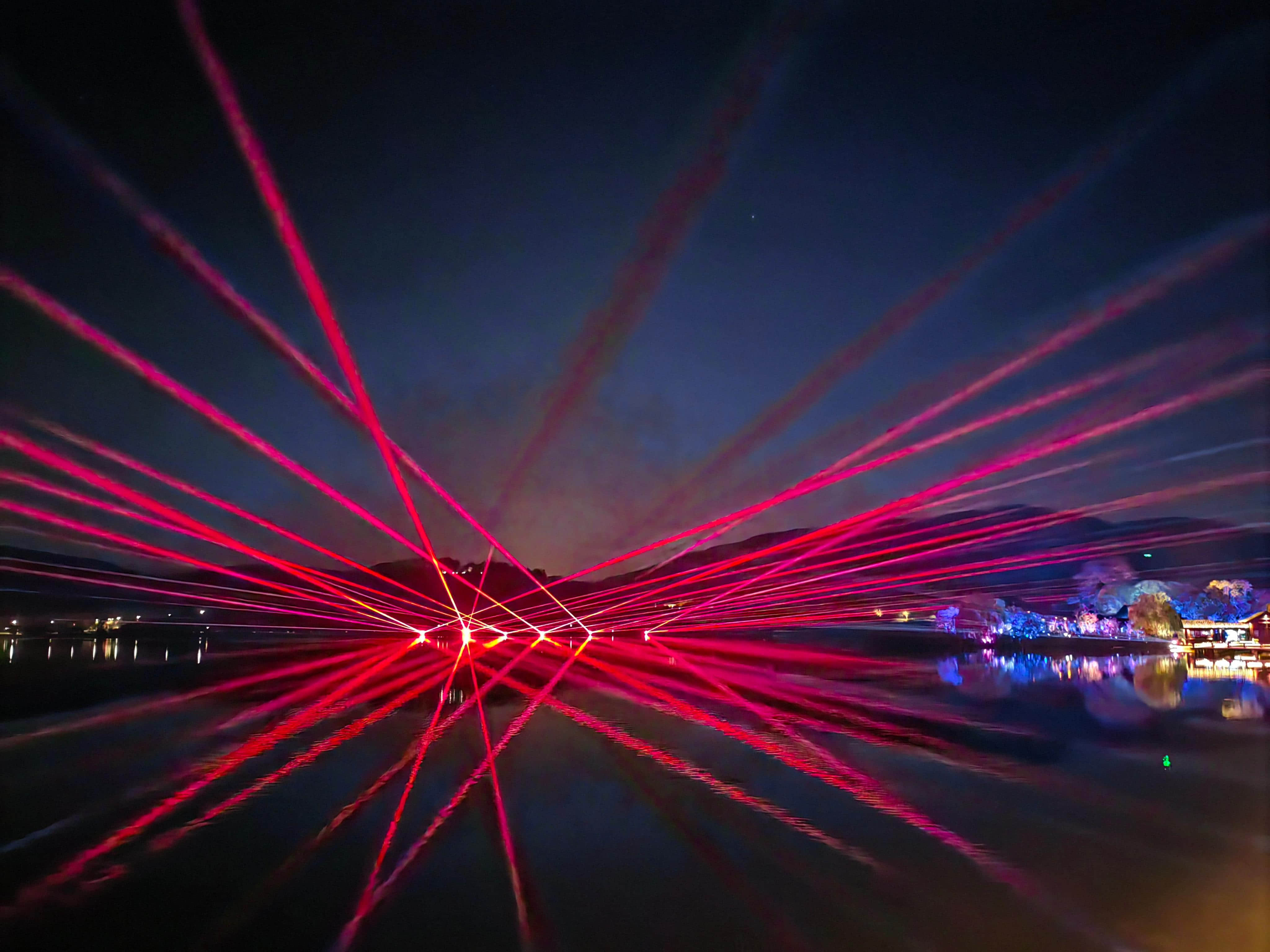 Nanbei Lake scenic area laser lighting project featuring illuminated architecture and blue landscape light effects in Jiaxing China Nanbei Lake scenic area laser lighting project featuring illuminated architecture and blue landscape light effects in Jiaxing China