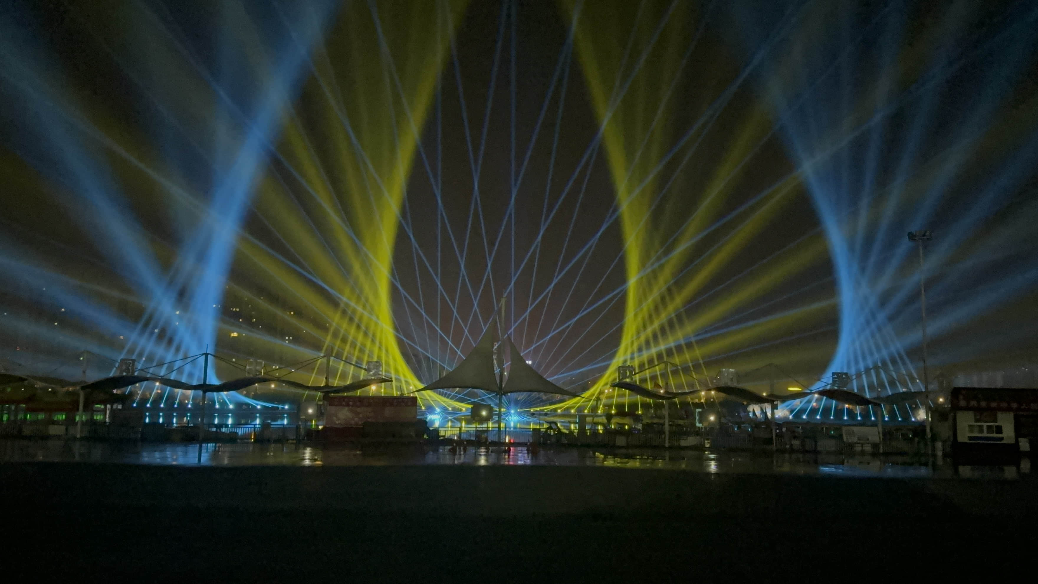 Xianyang Gudu Covered Bridge nighttime laser show featuring waterfront lighting, colorful laser beams and water effects
