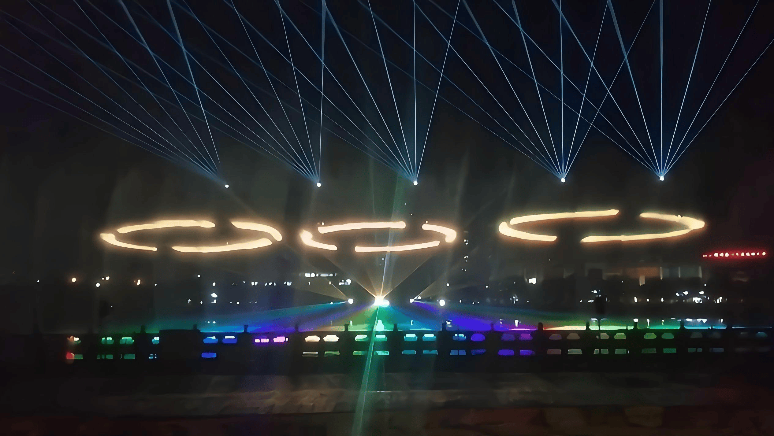 Green RGB laser beams forming wide fan-shaped patterns during the Xichuan urban nightscape light show