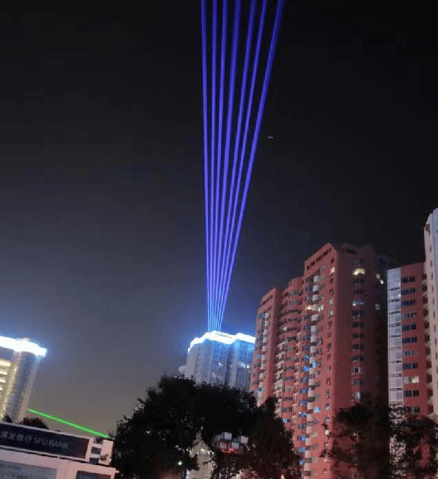 Xi'an Coffee Street architectural laser show featuring 50 high-power RGB laser systems and colorful city skyline effects