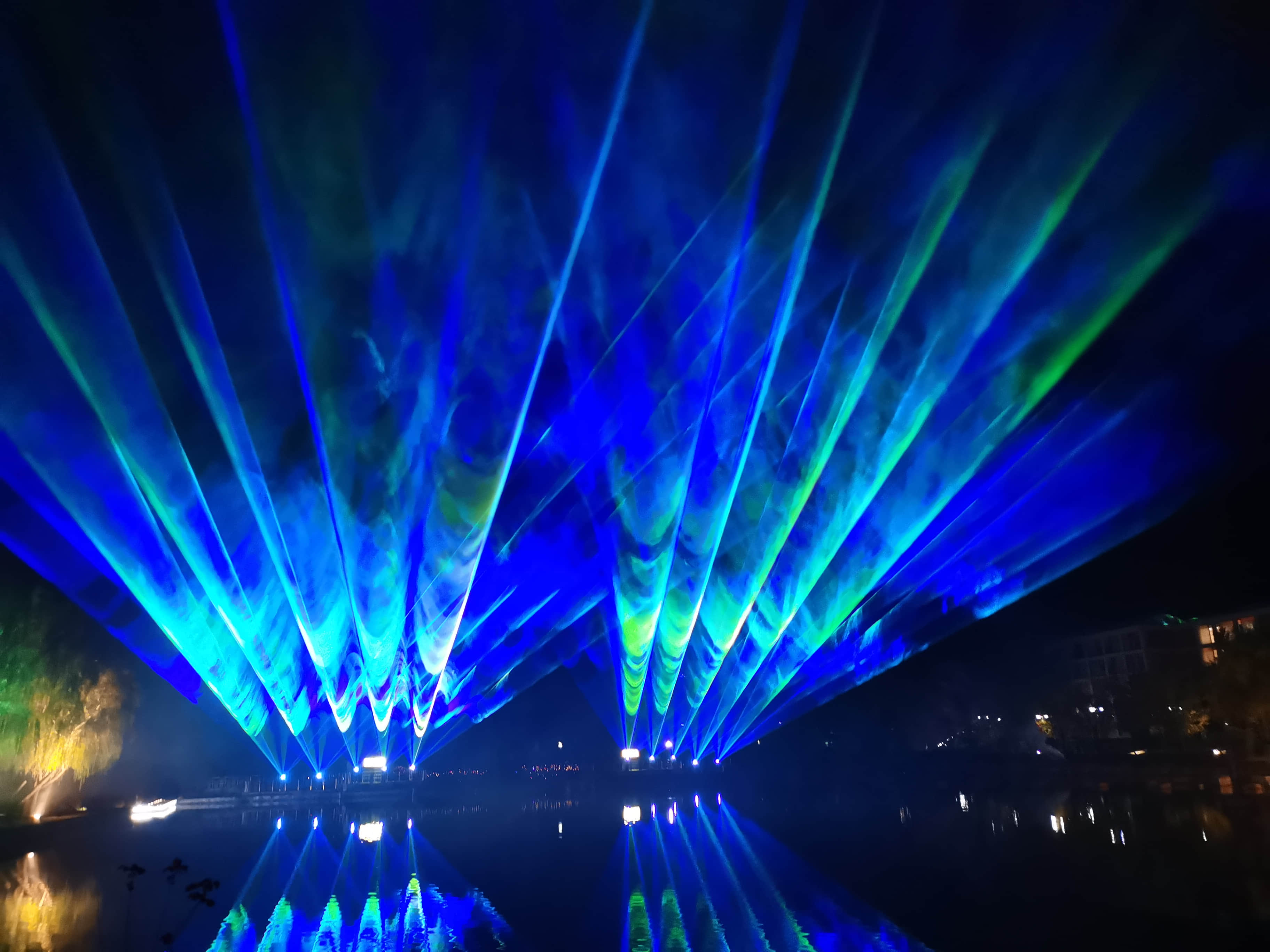 Xi'an Gaoke Hotel laser show featuring ten 60W RGB laser systems and waterfront lighting effects Xi'an Gaoke Hotel laser show featuring ten 60W RGB laser systems and waterfront lighting effects
