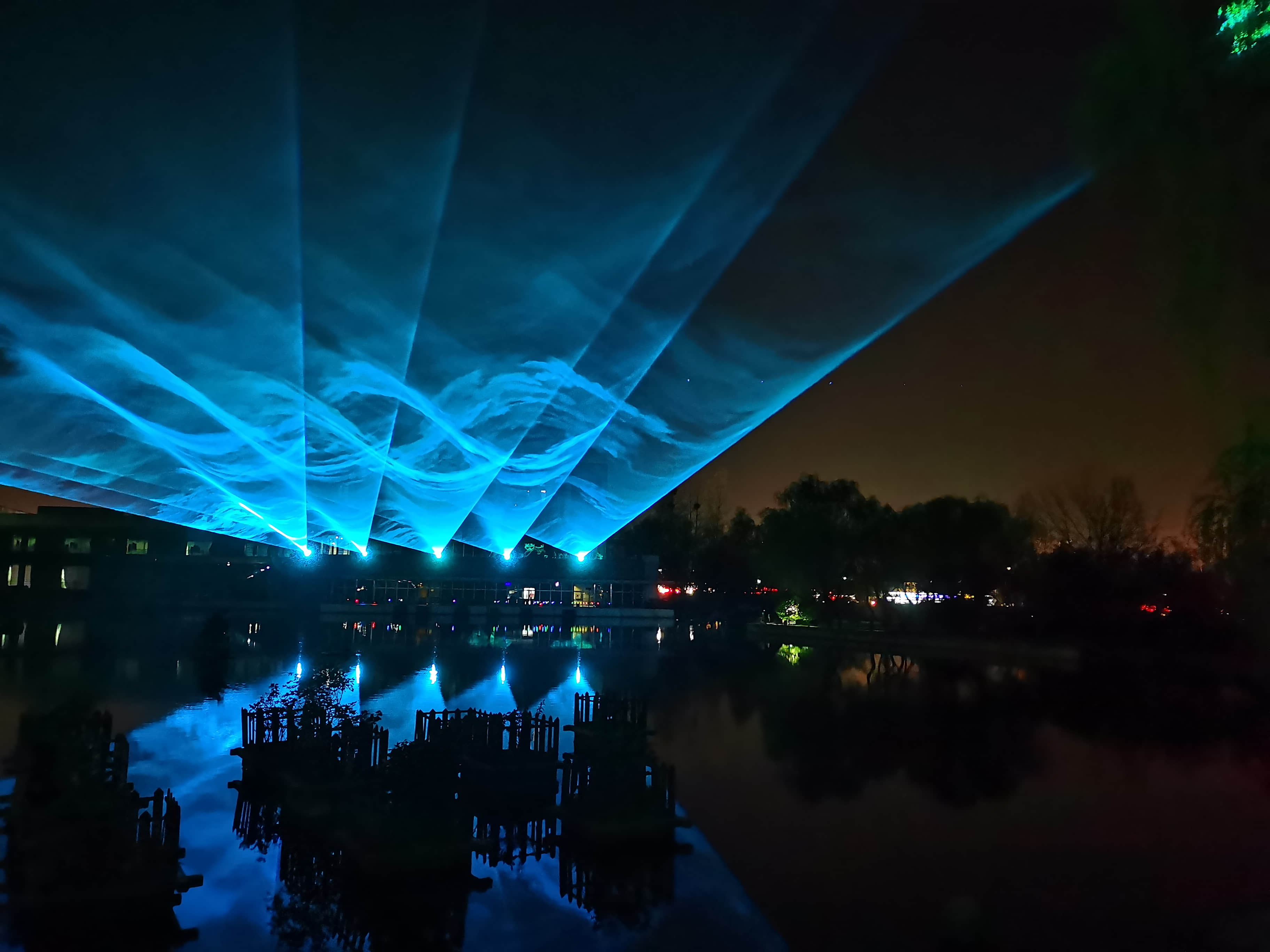 Xi'an Gaoke Hotel laser show featuring ten 60W RGB laser systems and waterfront lighting effects Xi'an Gaoke Hotel laser show featuring ten 60W RGB laser systems and waterfront lighting effects