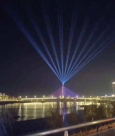 Huangchuan urban laser show featuring five 60W RGB laser systems and waterfront lighting effects