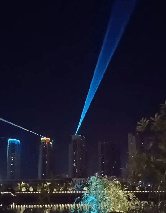 Huangchuan urban laser show featuring five 60W RGB laser systems and waterfront lighting effects