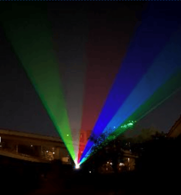 Green and purple outdoor laser beams extending into the night sky in Zhengzhou