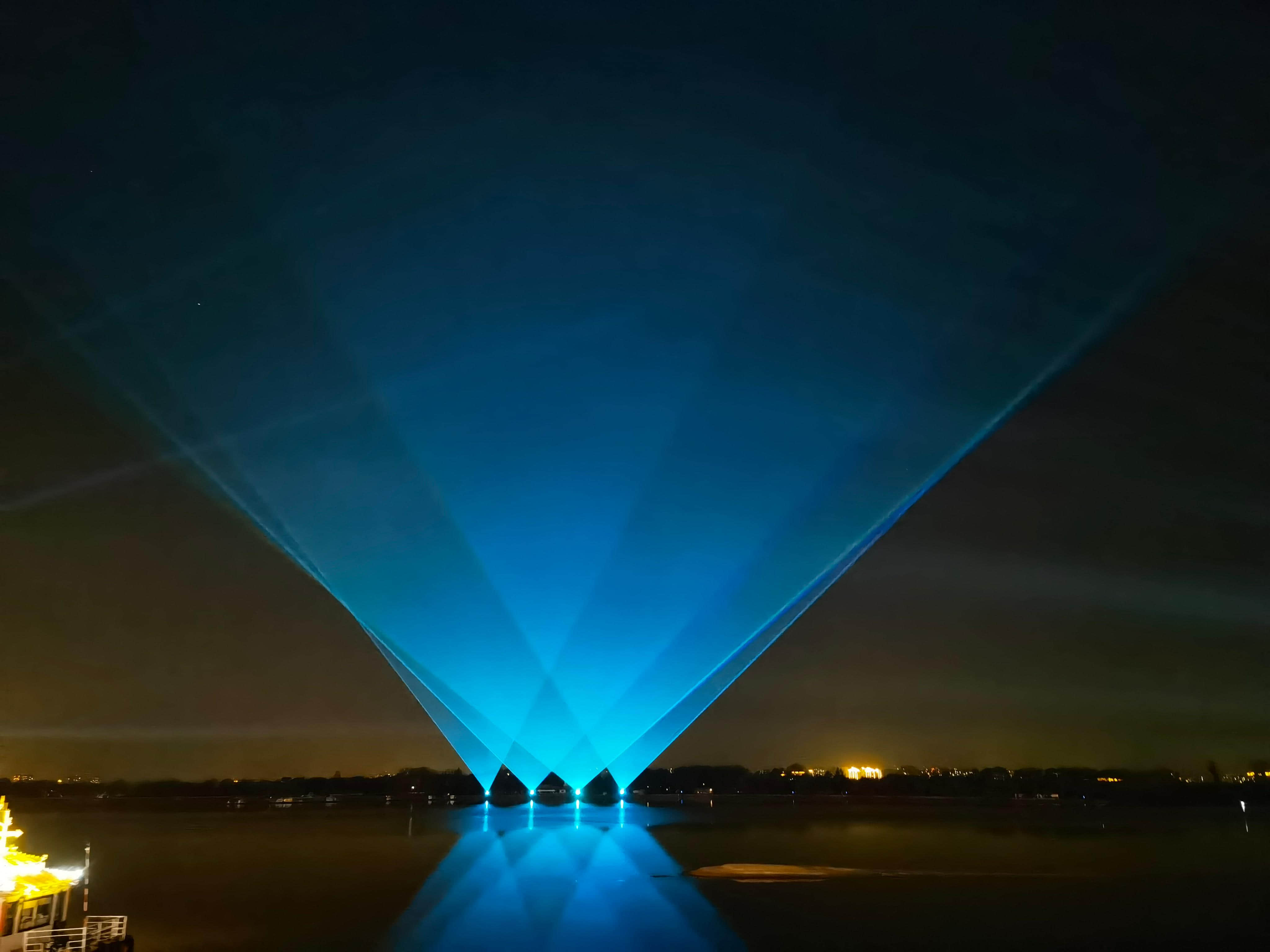 Outdoor laser lighting display at Harbin Flood Control Memorial Tower near the Songhua River in Heilongjiang, China Outdoor laser lighting display at Harbin Flood Control Memorial Tower near the Songhua River in Heilongjiang, China