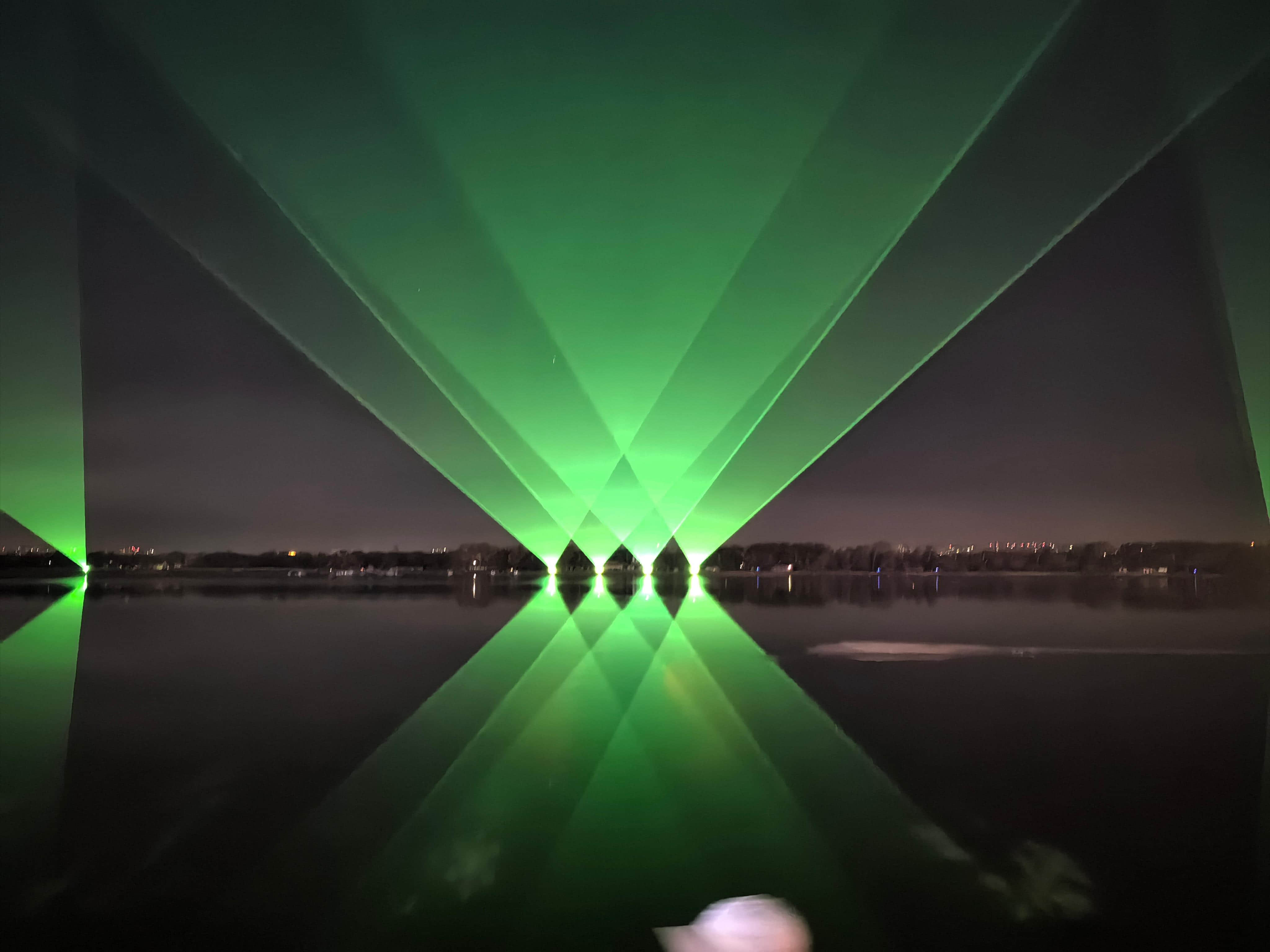 Outdoor laser lighting display at Harbin Flood Control Memorial Tower near the Songhua River in Heilongjiang, China Outdoor laser lighting display at Harbin Flood Control Memorial Tower near the Songhua River in Heilongjiang, China