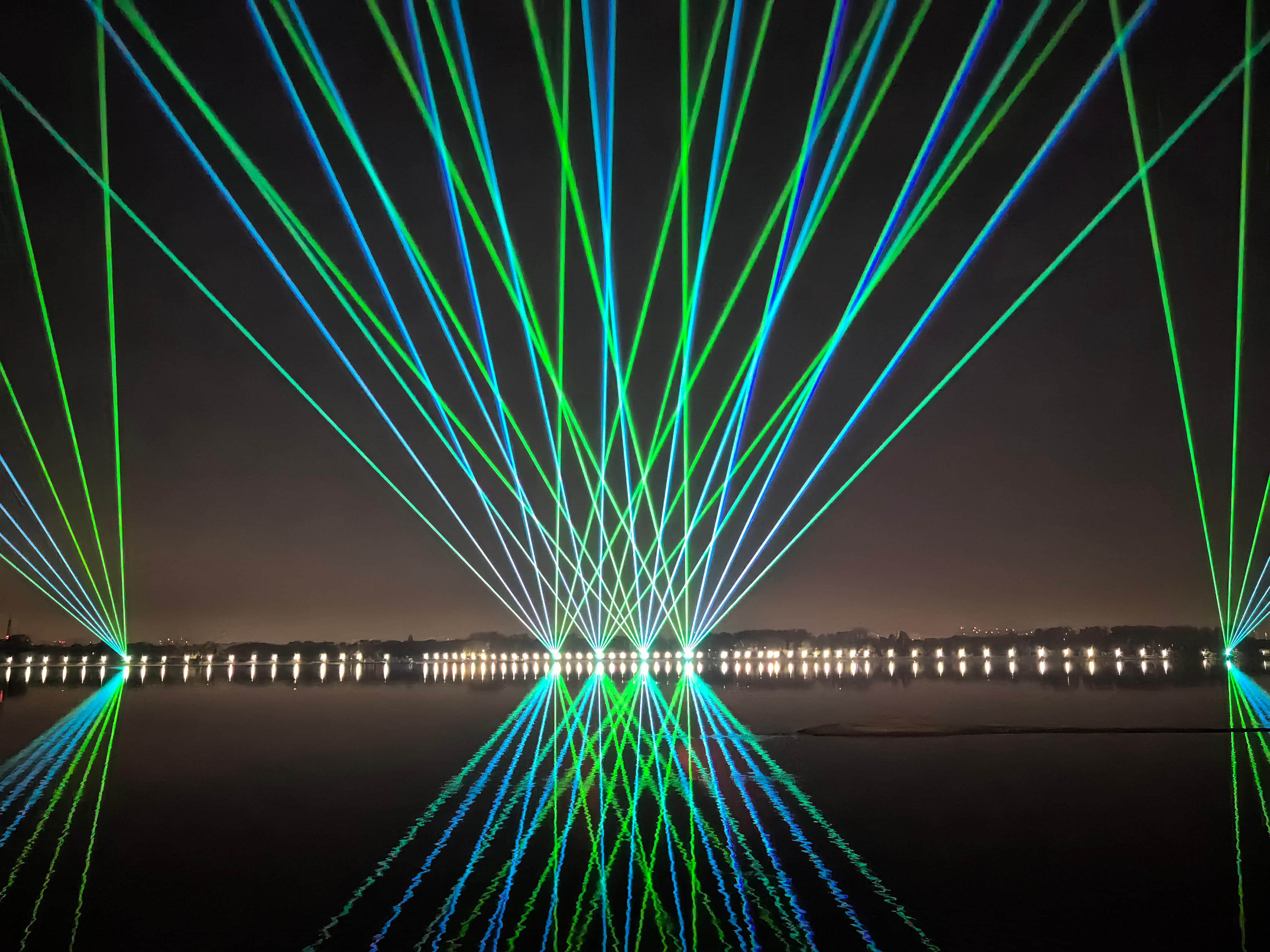 Outdoor laser lighting display at Harbin Flood Control Memorial Tower near the Songhua River in Heilongjiang, China Outdoor laser lighting display at Harbin Flood Control Memorial Tower near the Songhua River in Heilongjiang, China